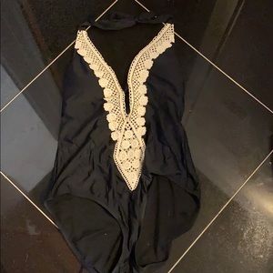 NWT one piece swim suit. Black with cream trim.